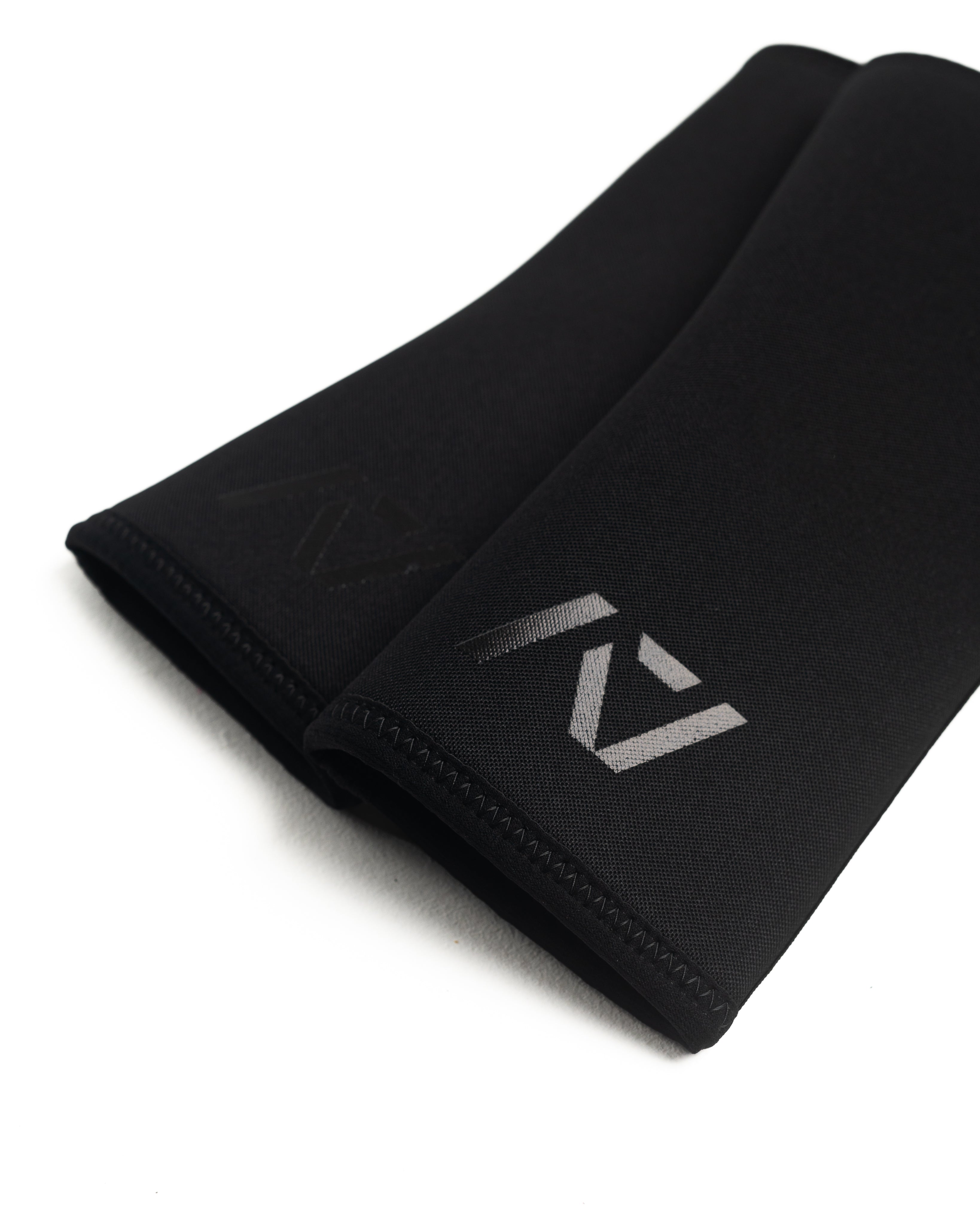 Flat lay of A7 Hourglass Knee Sleeves - showing knee sleeve stitching and A7 logo