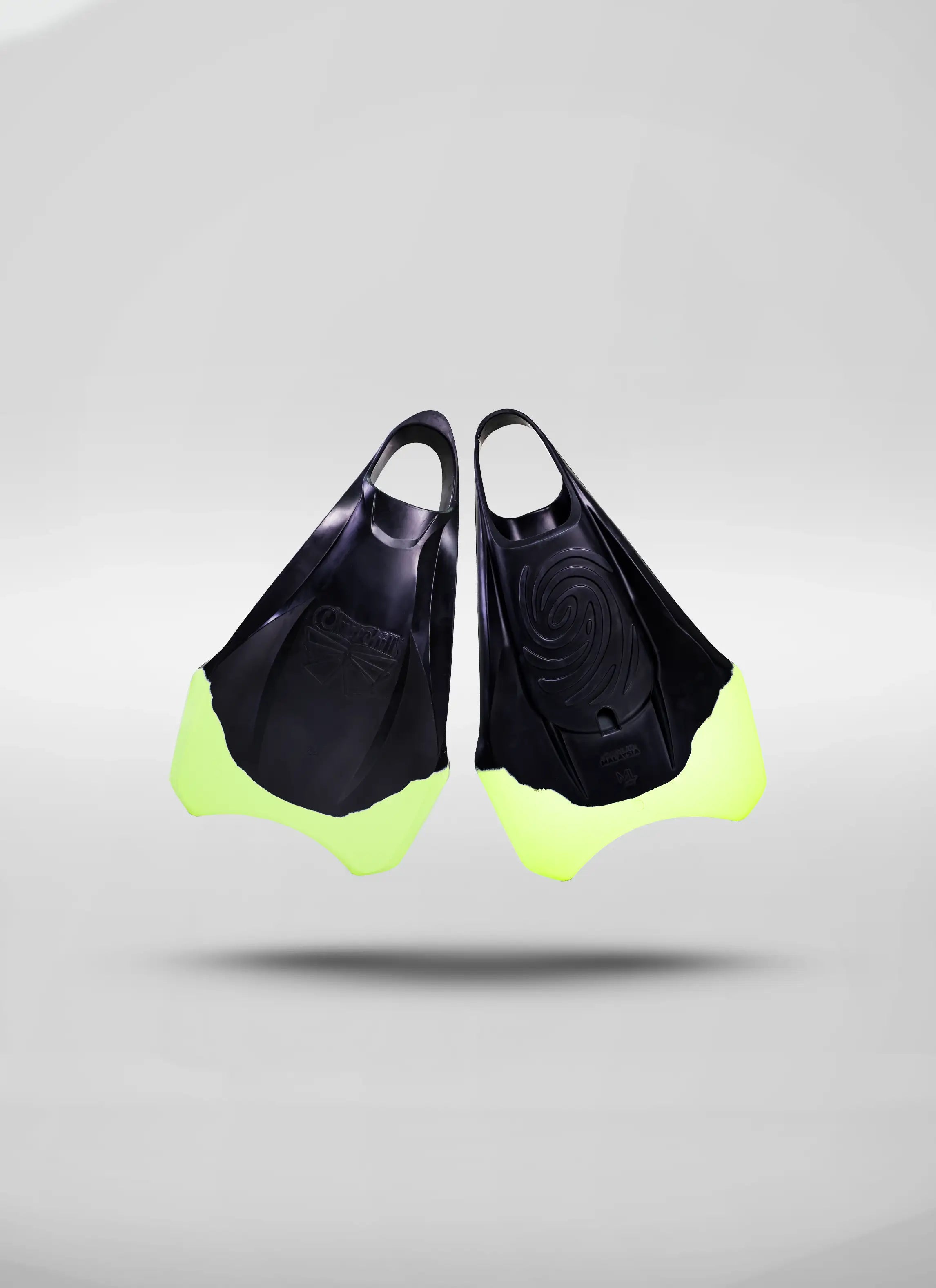 Pair of black and neon yellow bodyboarding swim fins on a light background.