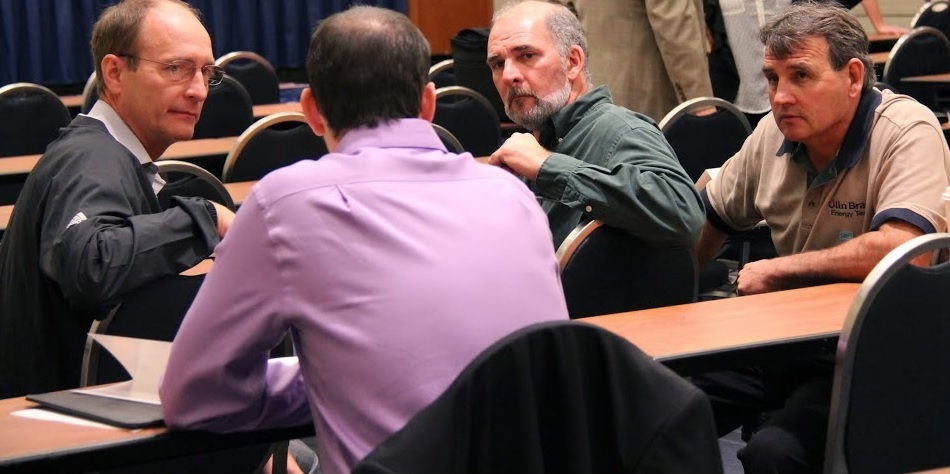 This photograph depicts a meeting among businessmen