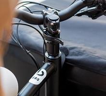 Close-up of a bicycle handlebar with an integrated ABS (anti-lock braking system), highlighting advanced safety features in modern cycling technology.