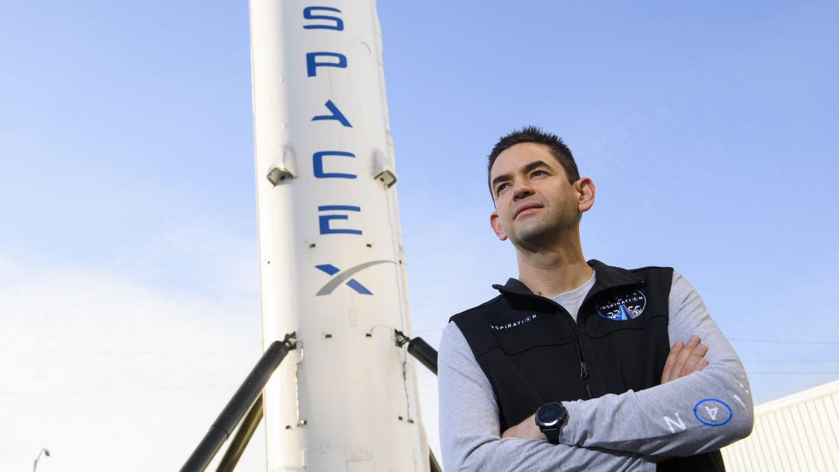Inspiration4 mission commander Jared Isaacman, founder and chief executive officer of Shift4 Payments, stands for a portrait in front of the recovered first stage of a Falcon 9 rocket at Space Exploration Technologies Corp. (SpaceX) on February 2, 2021 in Hawthorne, California.