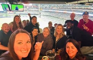 Team gathering at a baseball game
