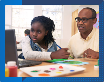 A person and a child working on a computer