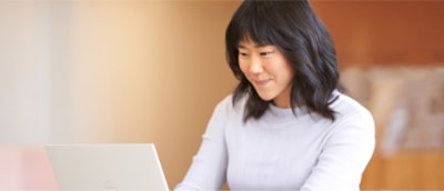 A person looking at a computer.