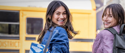 Two woman are smiling.