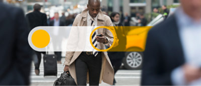 A person in a coat walking down a street