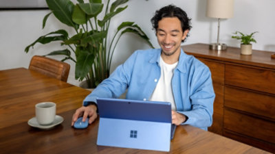 Man working on Microsoft Surface laptop