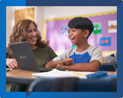 A person and a child looking at a computer