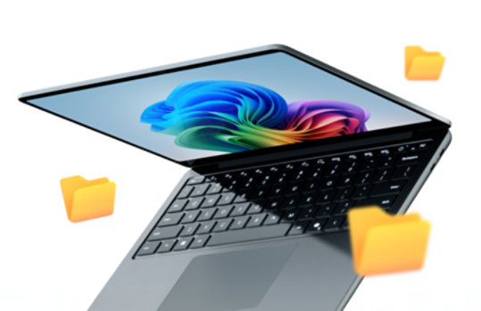 Angled view of a halfway open Surface laptop with the Microsoft rainbow bloom on the screen overlaid with file folder icons