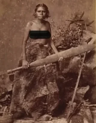 Aboriginal woman with a 'sword-club' or 'rainforest sword', Australia, ~1880