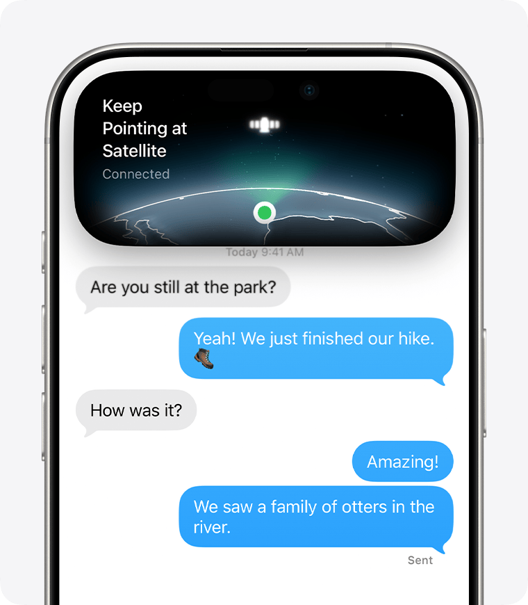 Sending a text message via satellite in the Messages app. The Dynamic Island indicates a strong satellite connection.
