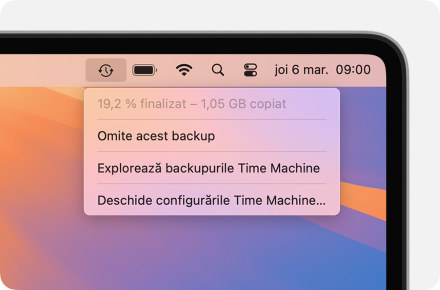 Meniul Time Machine care afișează un backup în curs.