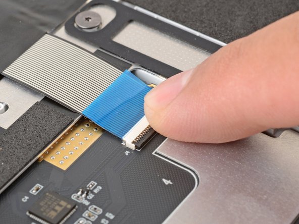 Use your finger to flip down and gently press the locking tab in place.