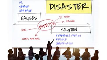 people around a table making disaster plans