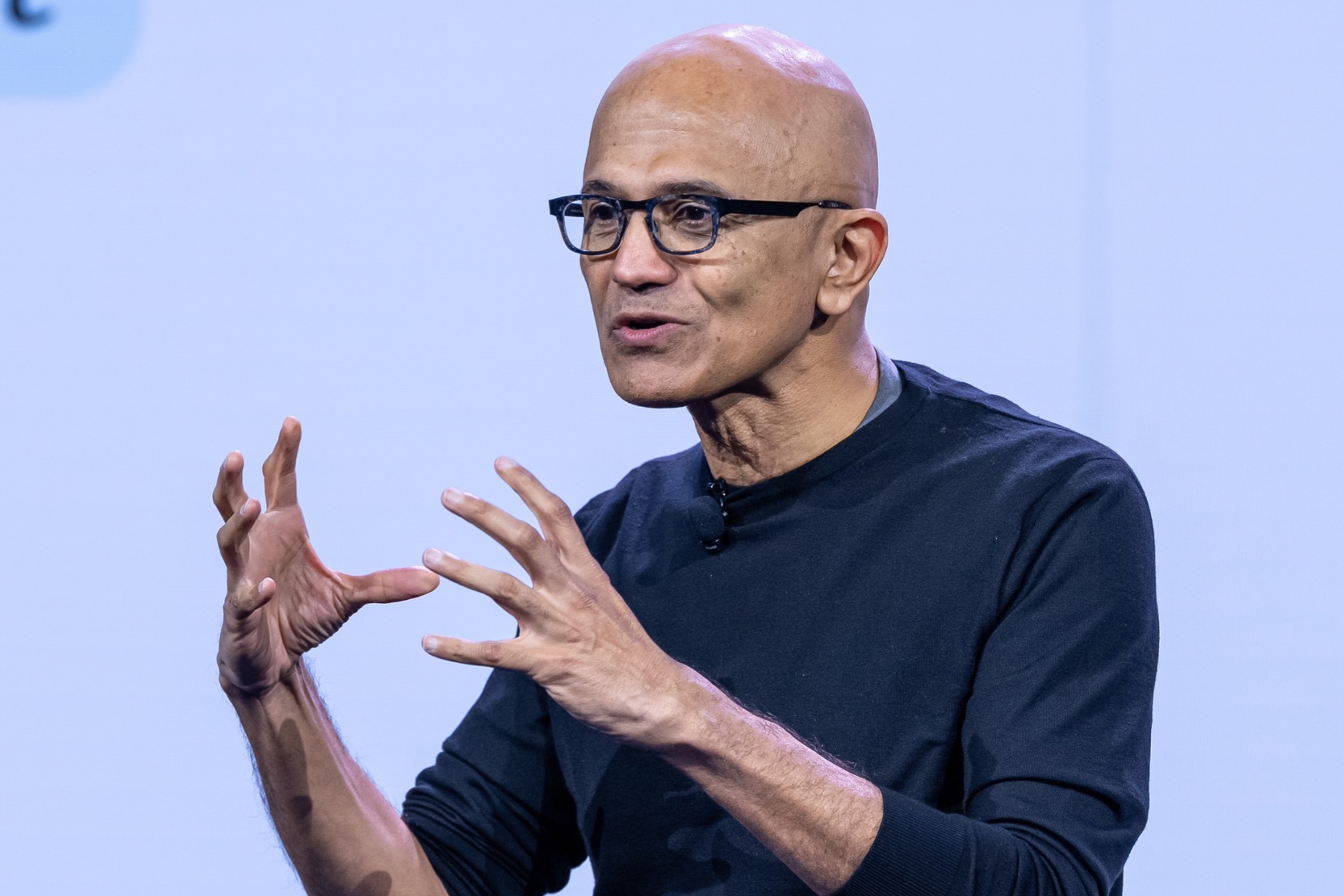 Satya Nadella gestures with both hands
