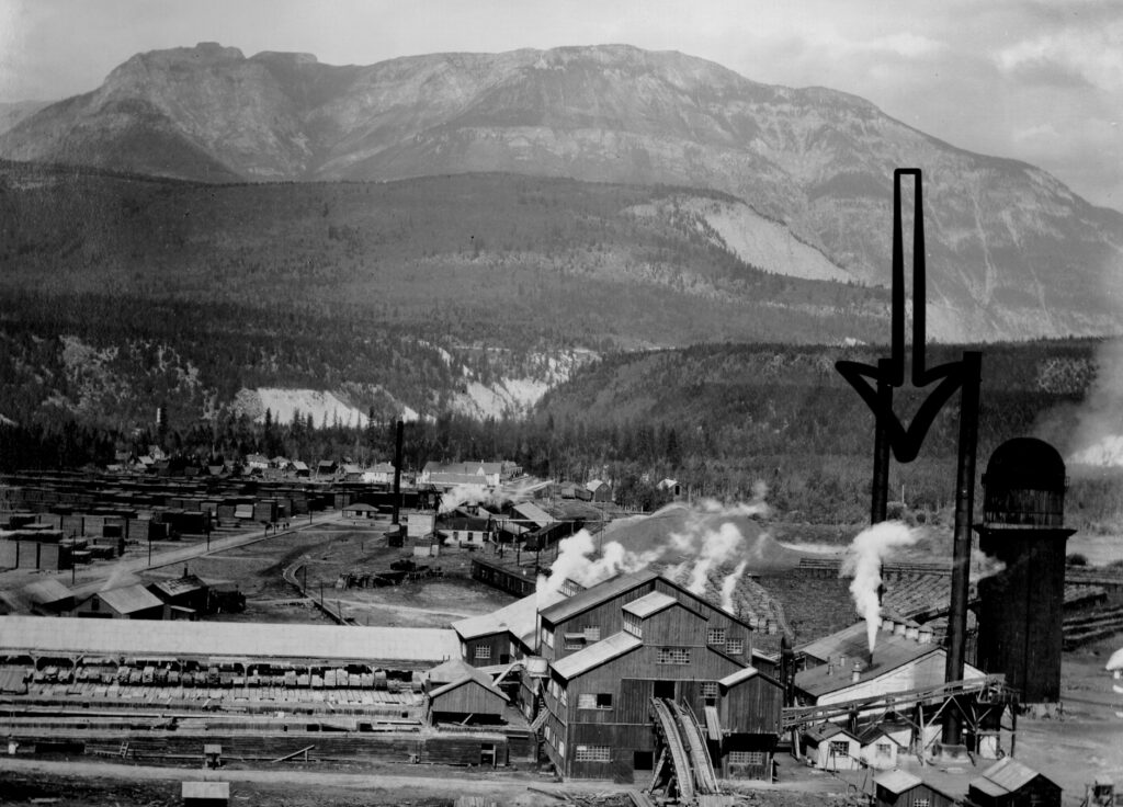 An old picture of a factory with an arrow draw over it