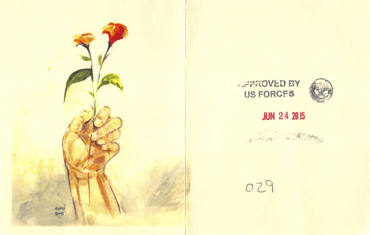 A painting of a hand holding the stems of two small red flowers, painted on what appears to be the blank page on the left hand side of a book, with the facing page on the right hand side stamped with words reading "Approved by the US Forces" and a date, with other details written by hand.