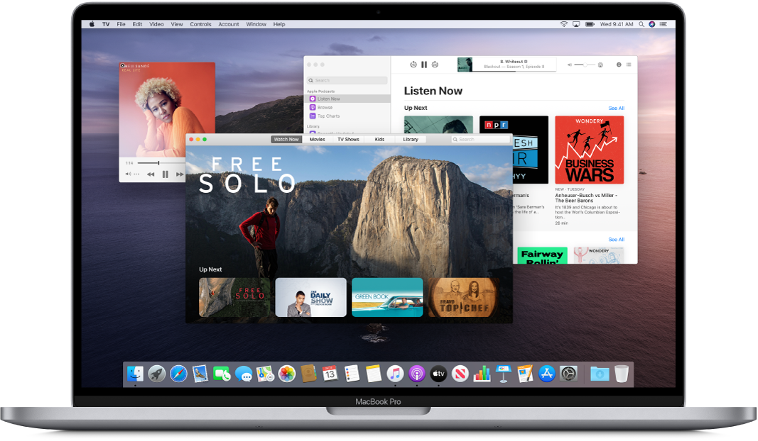 A MacBook Pro desktop showing the Music, TV, and Podcasts windows open.