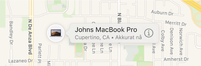 Et nærbilde av Informasjon-symbolet for Johns MacBook Pro.