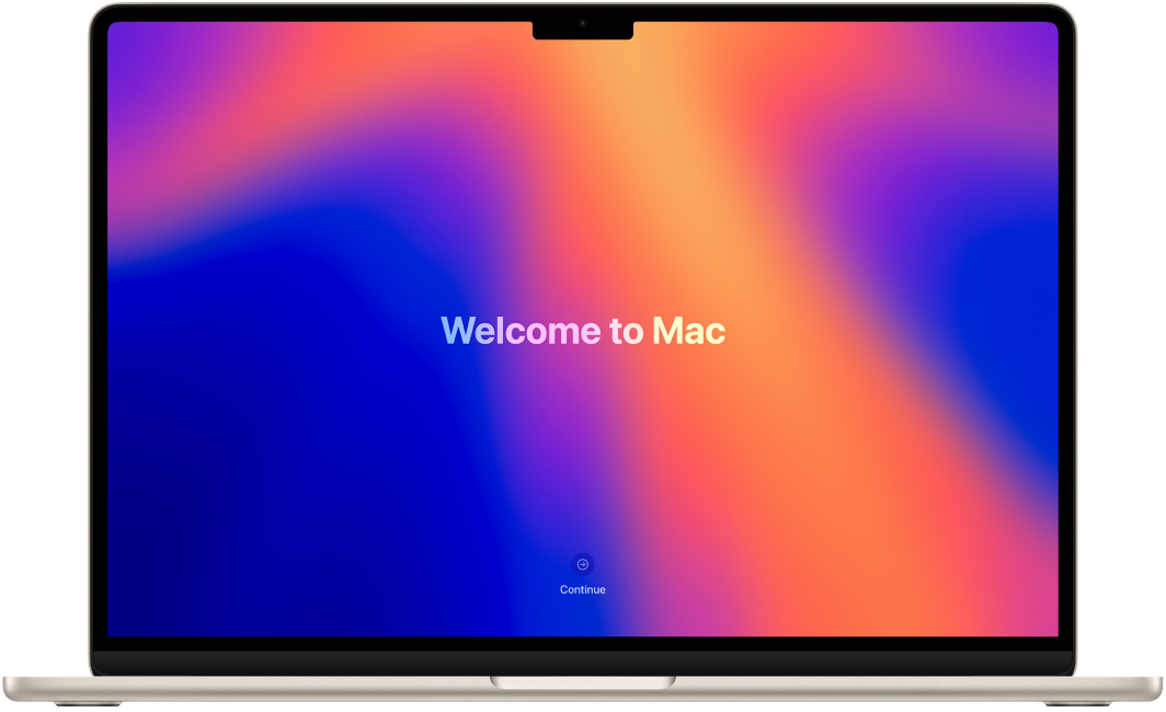 MacBook Air ouvert avec « Bienvenue sur le Mac » affiché à l’écran.