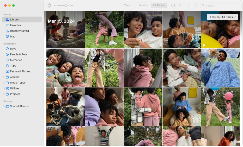 The Photos main window showing Library selected in the sidebar on the left, photos in a grid on the right, and the toolbar at the top.