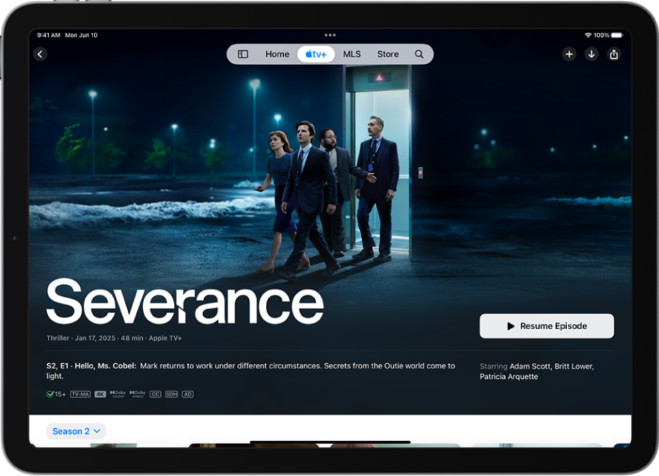 The Apple TV+ tab showing a featured Apple Original with the title, Play button, and a description of the episode. At the top of the screen, from left to right, are the Home, Apple TV+, MLS, Store, and Search tabs.
