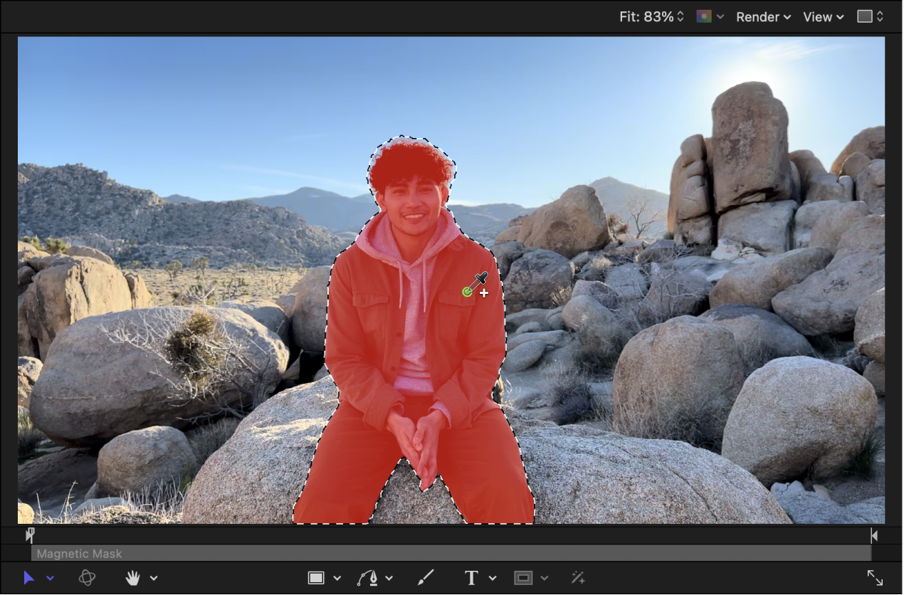 The canvas showing the Magnetic Mask being applied to isolate a person from a clip’s background. As the eyedropper is dragged, the person becomes highlighted, showing where the Magnetic Mask will be applied.