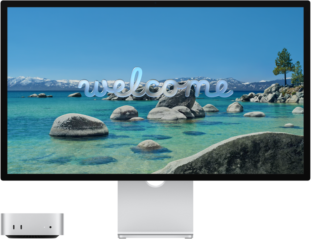 Een Mac mini en een Studio Display naast elkaar met "Welkom" op het scherm.