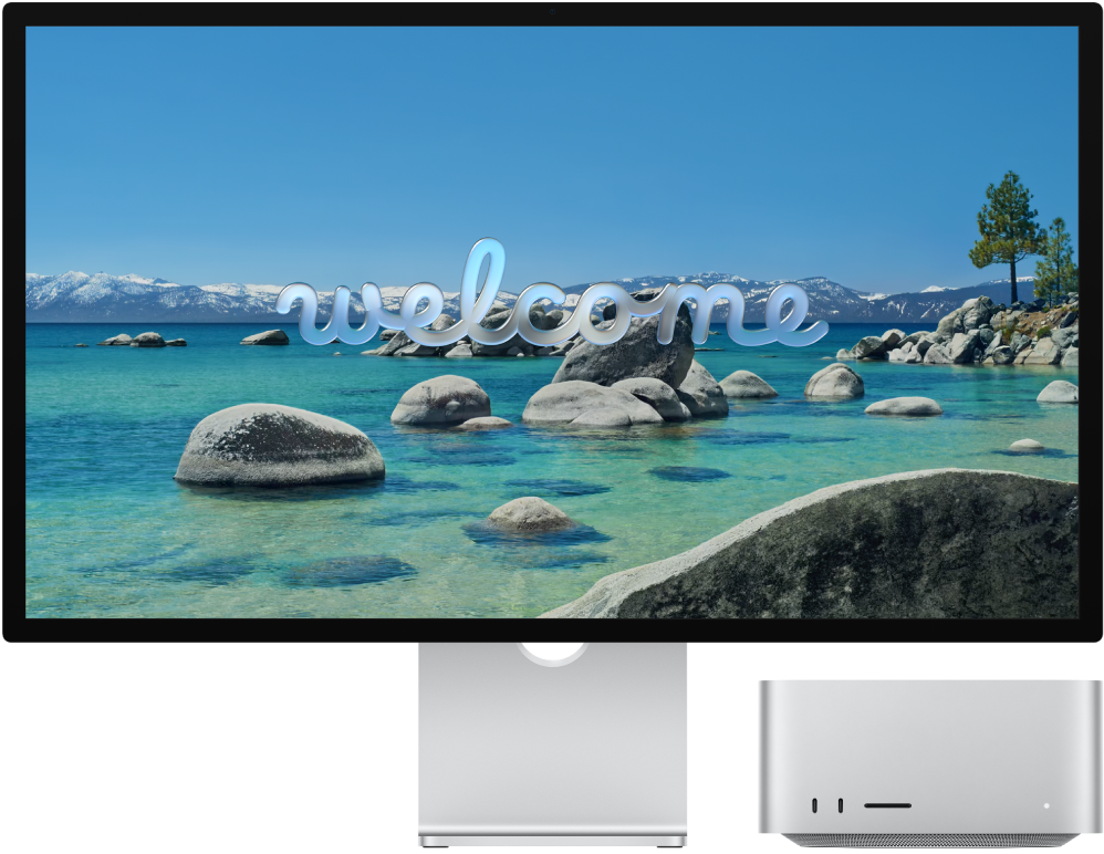 Studio Display dan Mac Studio berdampingan dengan kata “Selamat Datang” di layar.