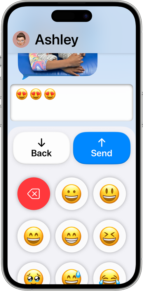 An iPhone in Assistive Access with the Messages app open. A message is being sent using an emoji-only keyboard.
