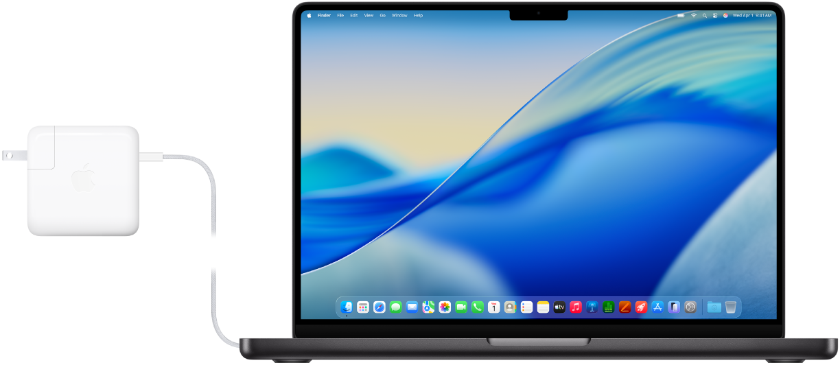 MacBook Pro z podłączonym zasilaczem.