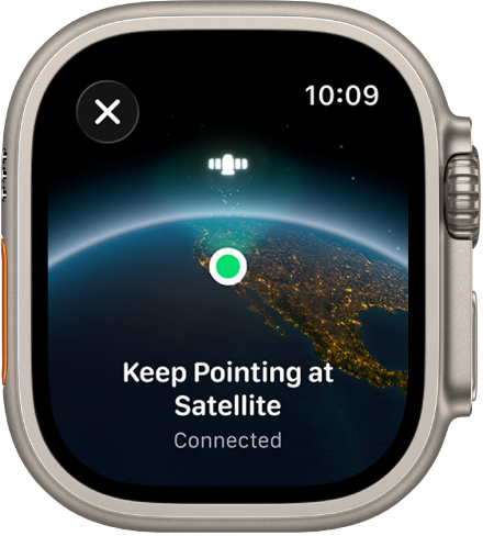 Экран со значком спутника над изогнутой поверхностью Земли, зеленым индикатором подключения и текстом «Сохраняйте ориентацию на спутник».