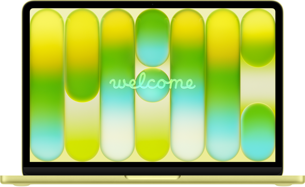 MacBook Neo với màn hình đang mở. Màn hình hiển thị từ “Welcome”.