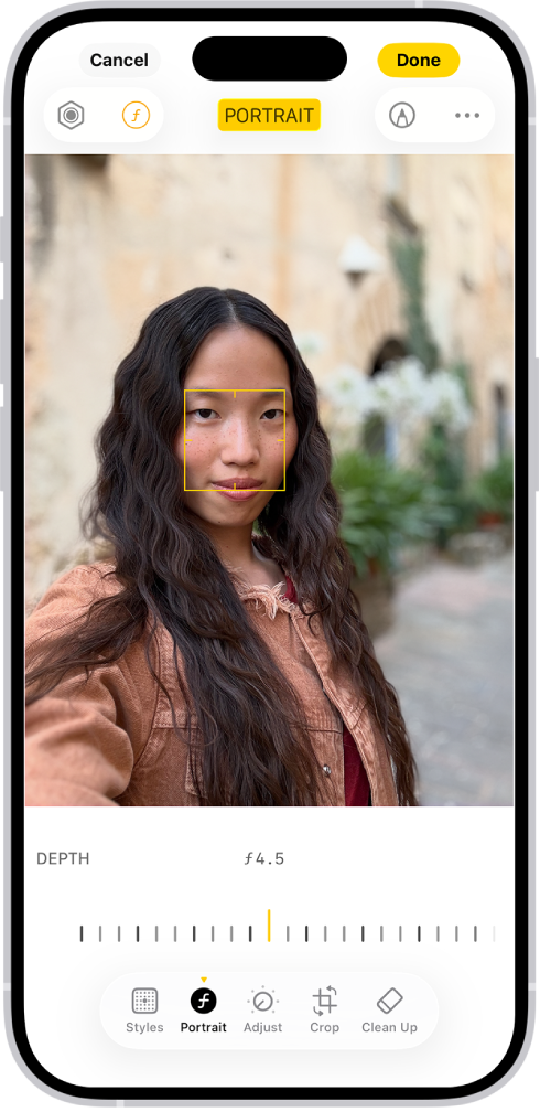 Екранът Редактиране в приложението Снимки с портрет в средата. Под снимката има плъзгач за коригиране на настройката Корекция на дълбочина. Под плъзгача, от ляво надясно са бутоните Стил, Портрет, Коригирай, Филтри, Изрежи и Изчисти. Избран е бутонът Портрет.