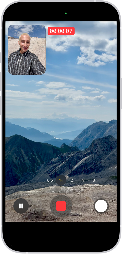 A aplicação Câmara no modo Vídeo a gravar um vídeo de captura dupla. Uma janela na parte superior esquerda da moldura mostra o que a câmara frontal está a gravar e o resto da moldura mostra o que a câmara traseira está a gravar.