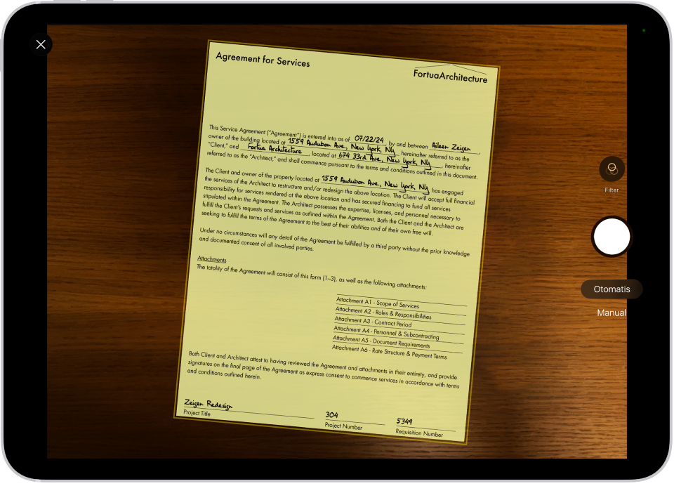 Layar yang menampilkan dokumen yang sedang dipindai. Tombol Ambil Gambar ada di sebelah kanan.
