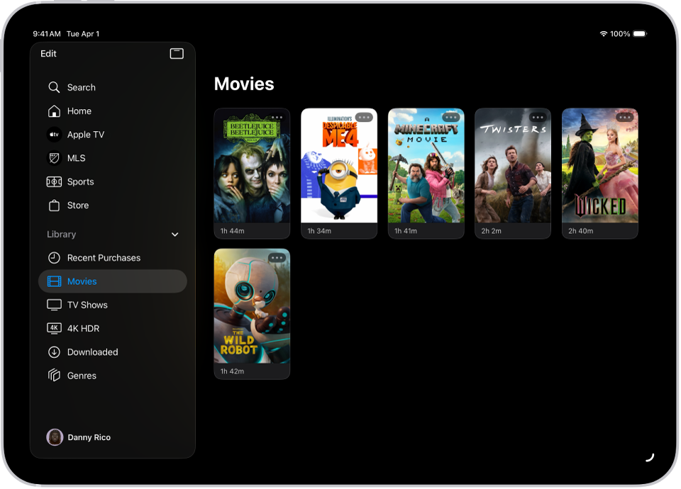 Un iPad afișând o listă de filme în secțiunea Filme a filei Bibliotecă.