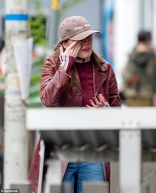 White Lotus star Aimee Lou Wood appeared to break down in tears and be comforted by a pal in London on Monday following SNL's 'mean and unfunny' skit about her teeth