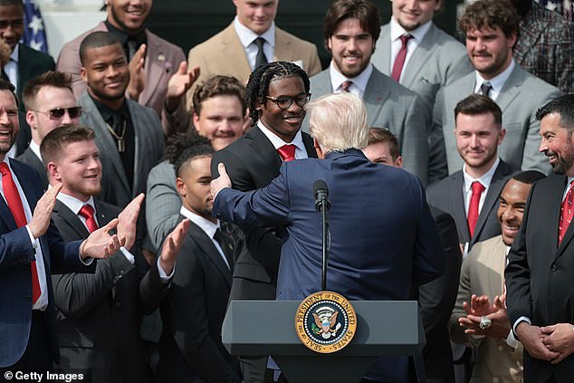 U.S. President Donald Trump welcomes the 2025 College Football National Champions from Ohio State University to the White House during a ceremony on the south lawn