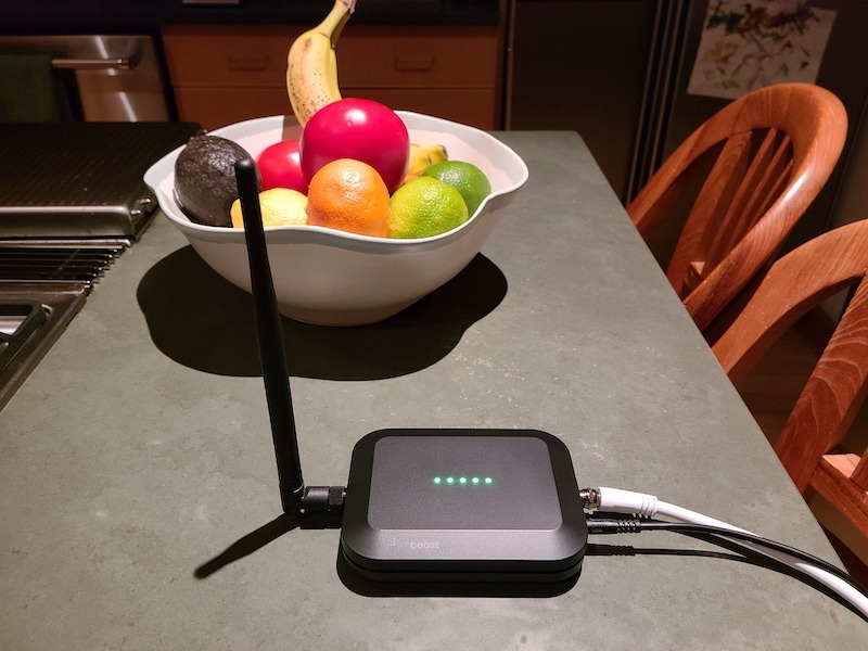 Home Studio indoor unit on a kitchen counter next to a bowl of fruit