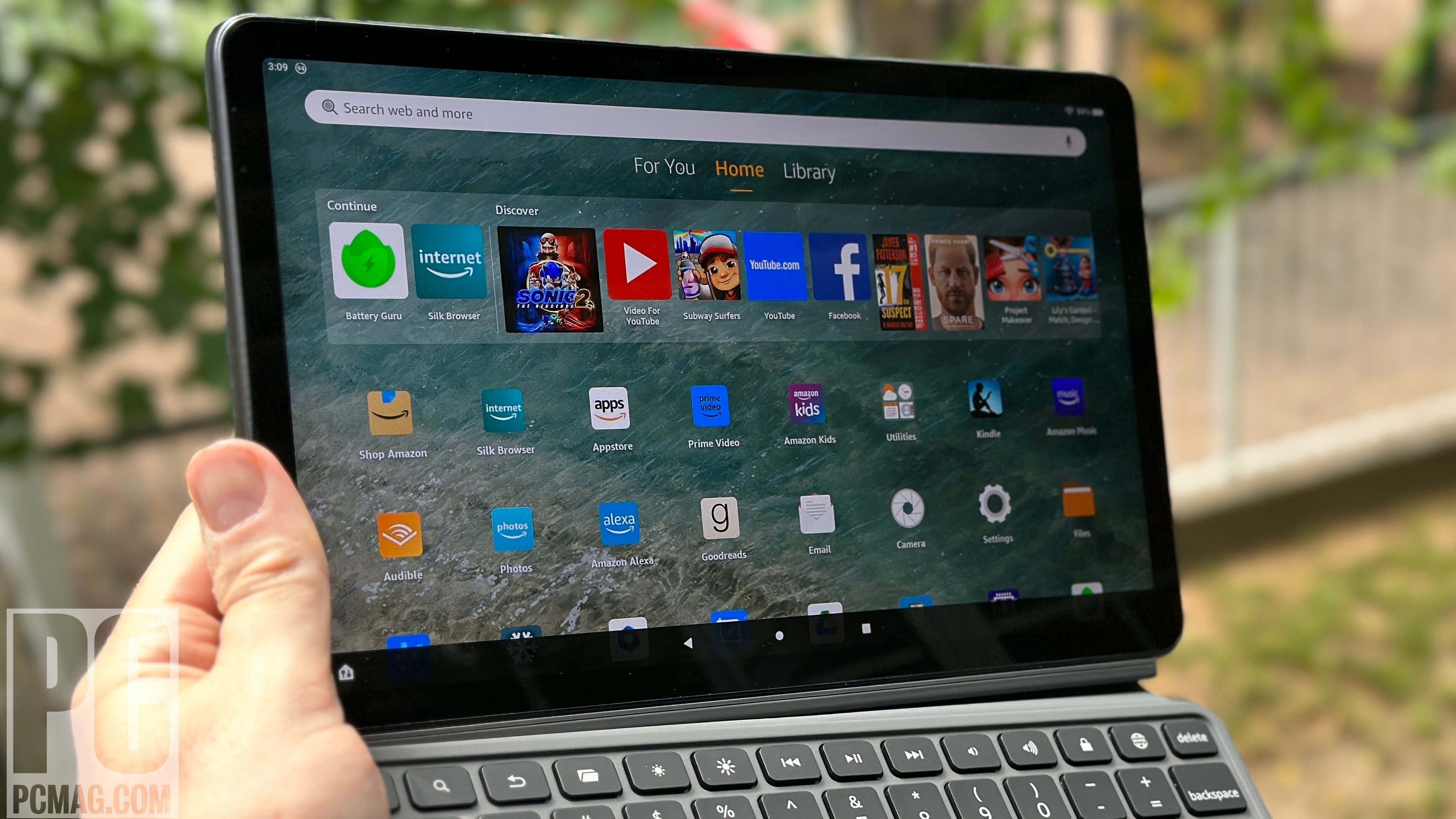 Fire Max 11 tablet in hand