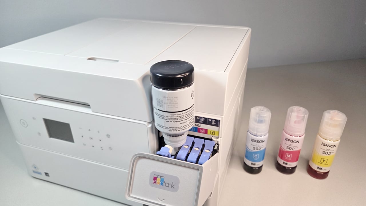Epson EcoTank ET-3950 black ink fill with cyan, yellow, and magenta bottles on the side
