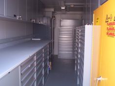 the inside of a storage room with lots of drawers