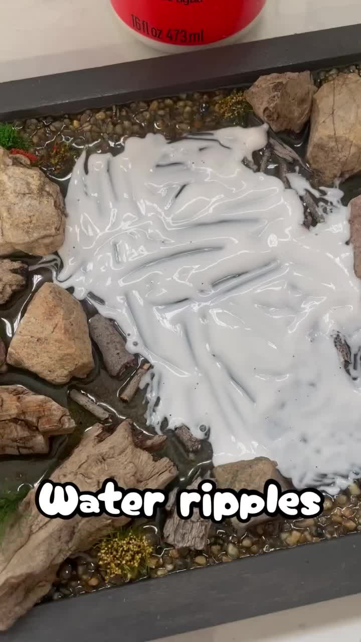 Enhancing the realistic charm of our Spring Village Pond by adding water ripple effects with glossy Mod Podge.  Enjoy the beautiful transformation!  #miniatures #villagesofallseasons #dioramas #miniaturas #artesanato #art #crafts #artesanal #artesã #craft #christmas #christmasvillage #vilanatalina