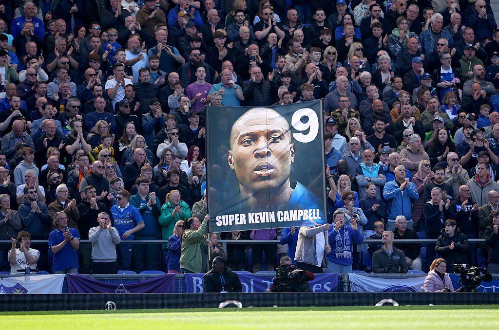 A banner bearing Kevin Campbell's face and name is raised by fans at Goodison park during the Premier League fixture between Everton and Arsenal.