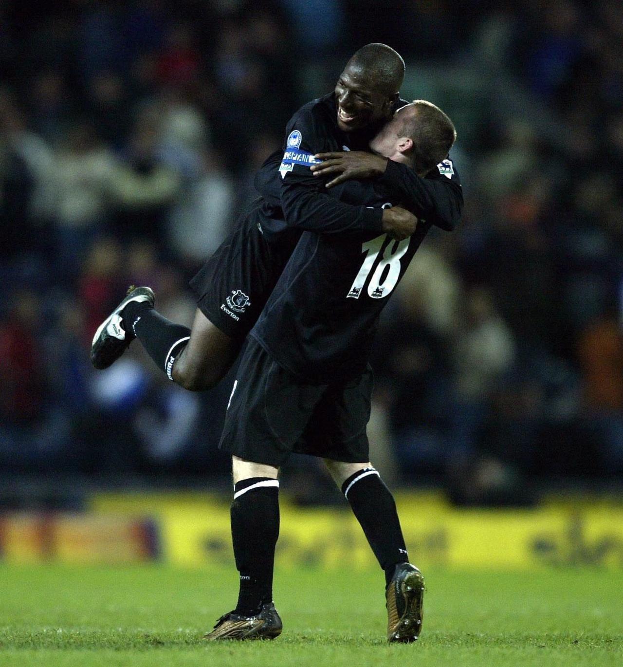 Wayne Rooney lifts Kevin Campbell in the air as the pair celebrate a goal in the Premier League