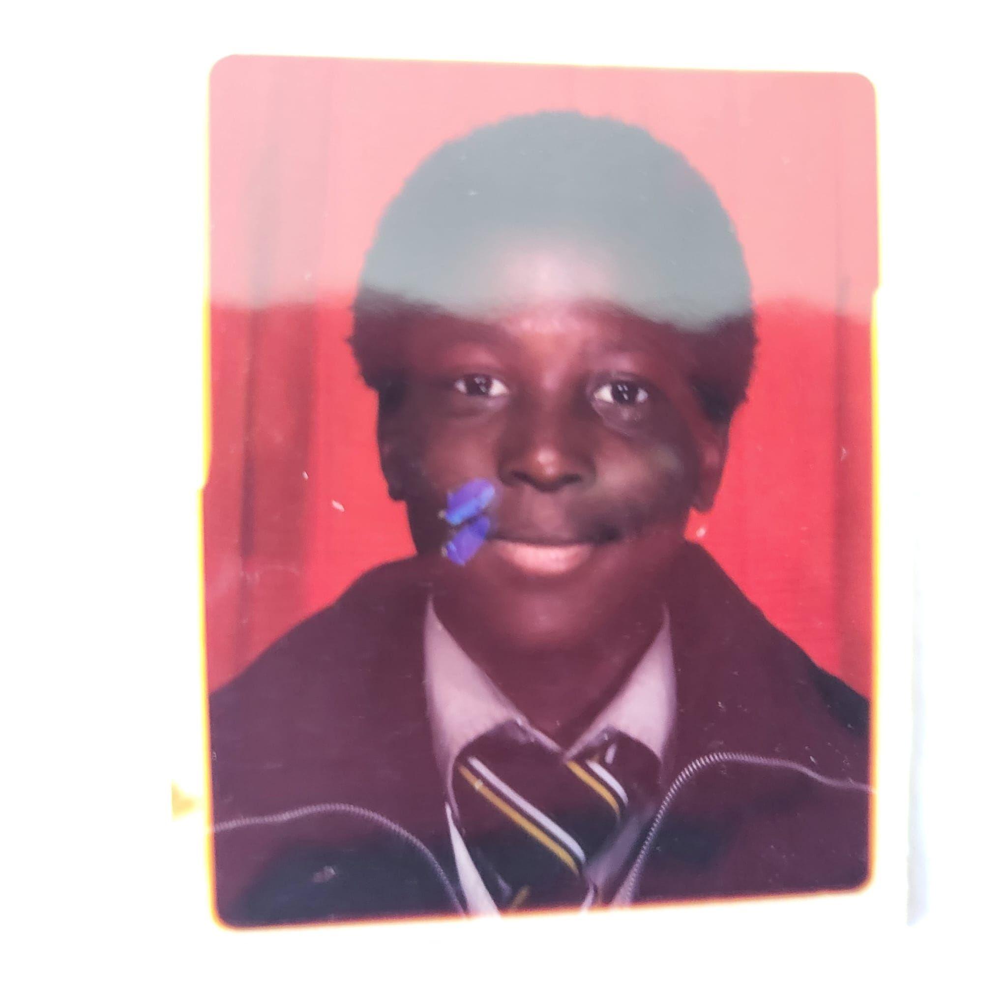 Kevin Campbell poses for a school photograph as a teenager