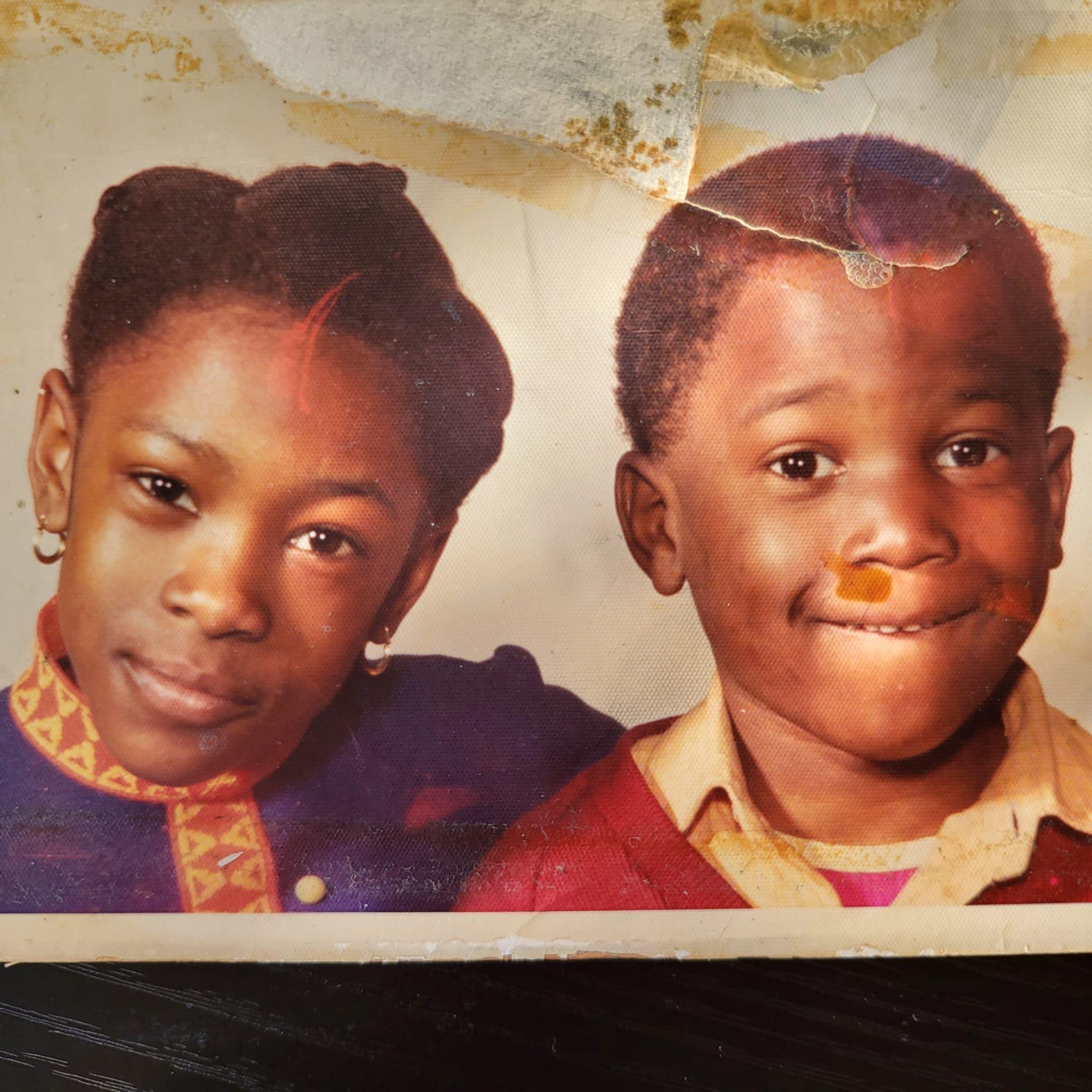 Lorna and Kevin Campbell pose for a family photo as children