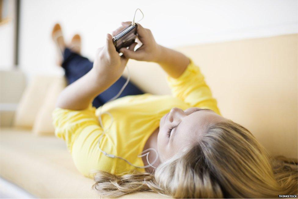Woman listening to music on her phone