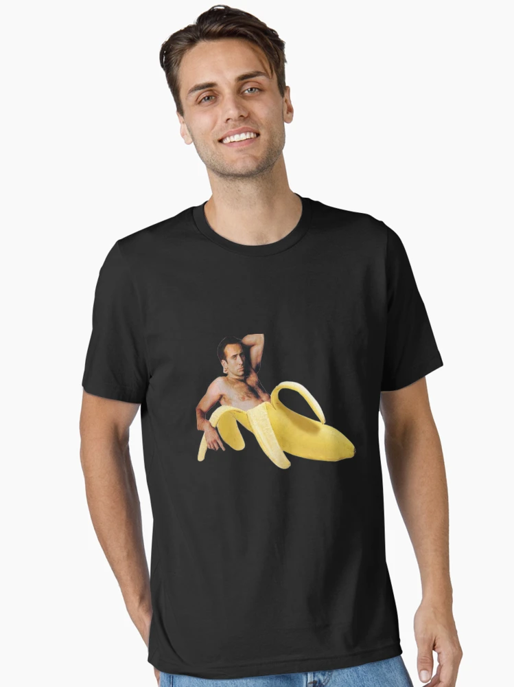 Imagen 2 de 7, Camiseta esencial con la obra nicholas cage banana, diseñada y vendida por bottlealliance.